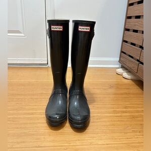 Black tall hunter boots
